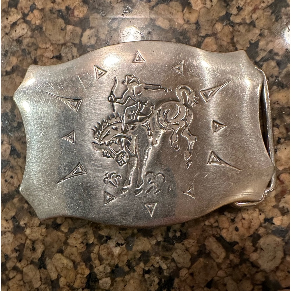 Cowboy silver belt buckle